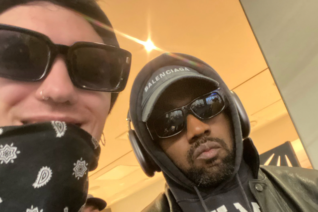 <p>Kanye West posing with Goody Grace at LAX</p>
