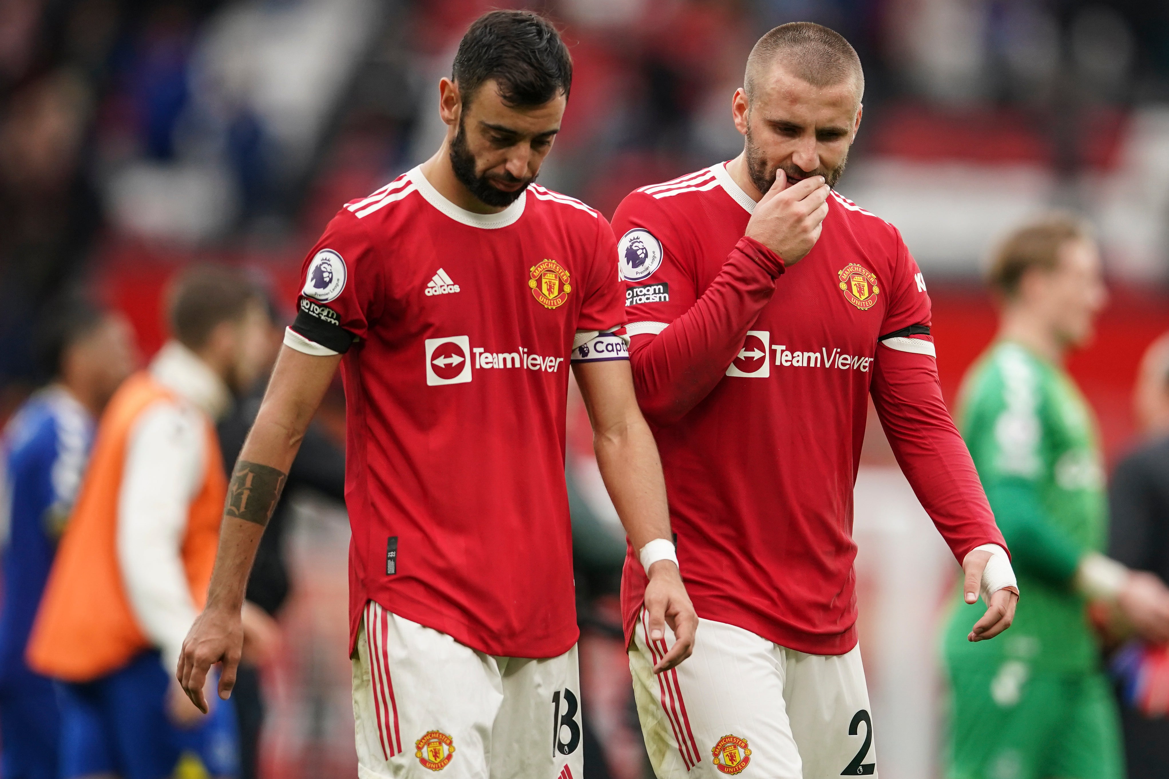 Bruno Fernandes (left) leaves the field with Luke Shaw after the 1-1 draw with Everton