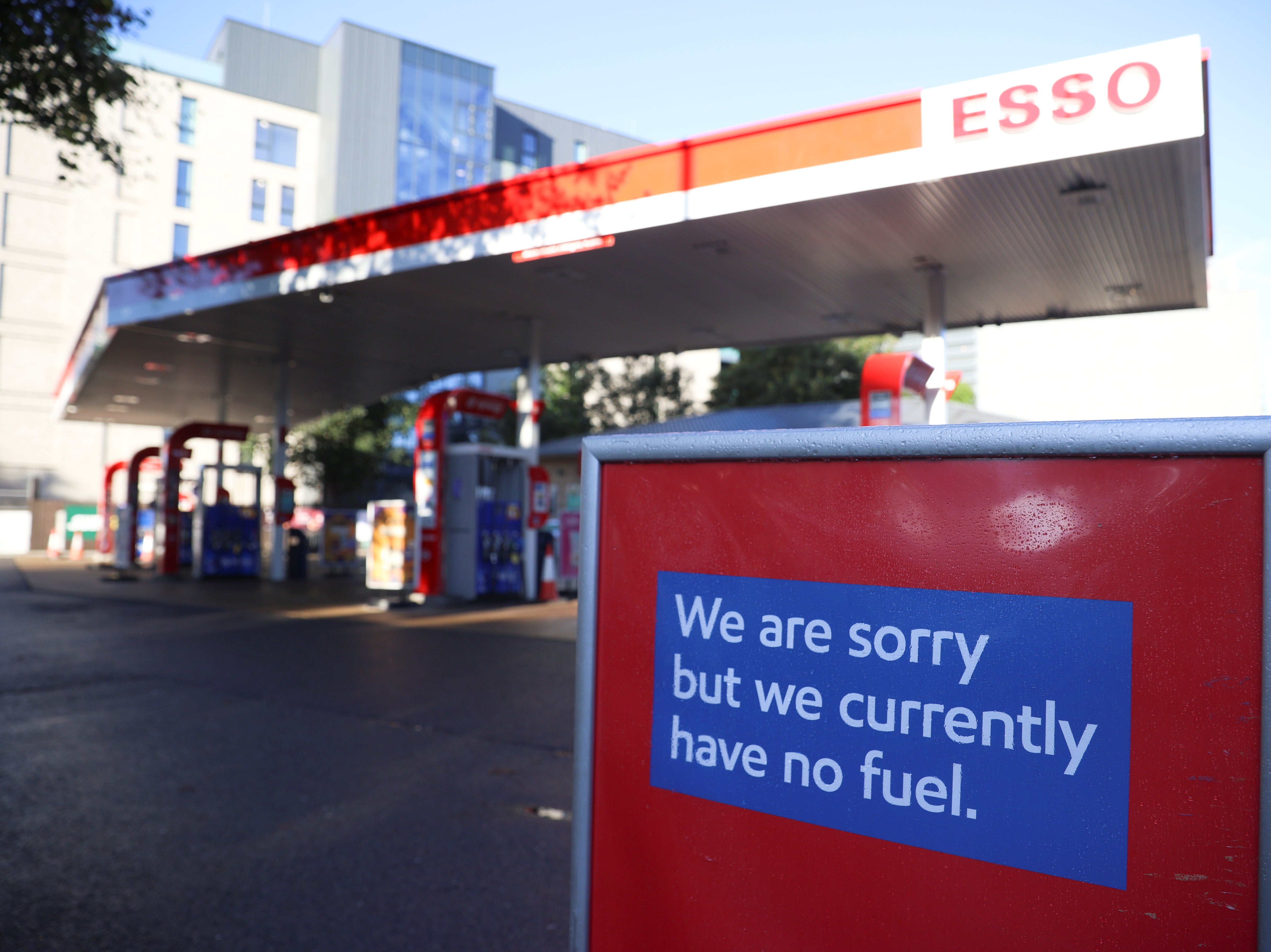 A sign informing customers that fuel has run out is pictured at a Esso fuel station in London