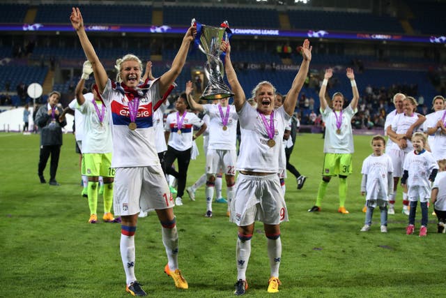 Lyon’s Ada Hegerberg (left) and Eugenie Le Sommer celebrate winning the Women’s Champions League final at the Cardiff City Stadium (Nick Potts/PA)