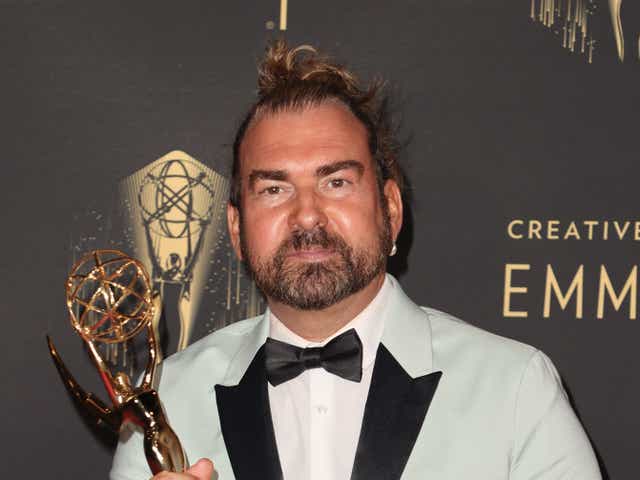<p>Marc Pilcher poses with the award for Outstanding Period And/Or Character Hairstyling for ‘Bridgerton’ at the 2021 Emmys</p>