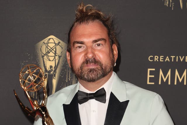 <p>Marc Pilcher poses with the award for Outstanding Period And/Or Character Hairstyling for ‘Bridgerton’ at the 2021 Emmys</p>