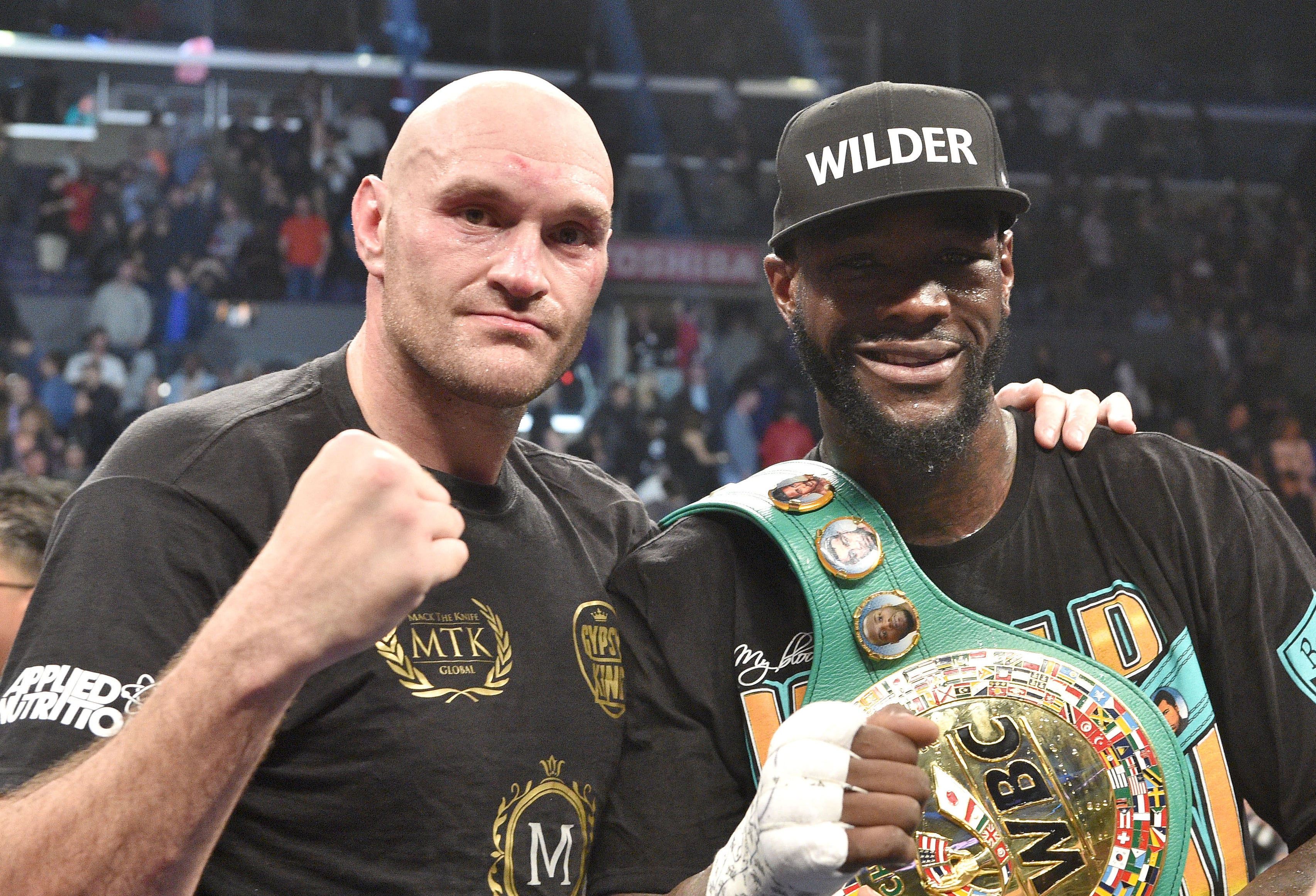 Deontay Wilder, right, and Tyson Fury will fight for a third time this weekend (Lionel Hahn/PA)