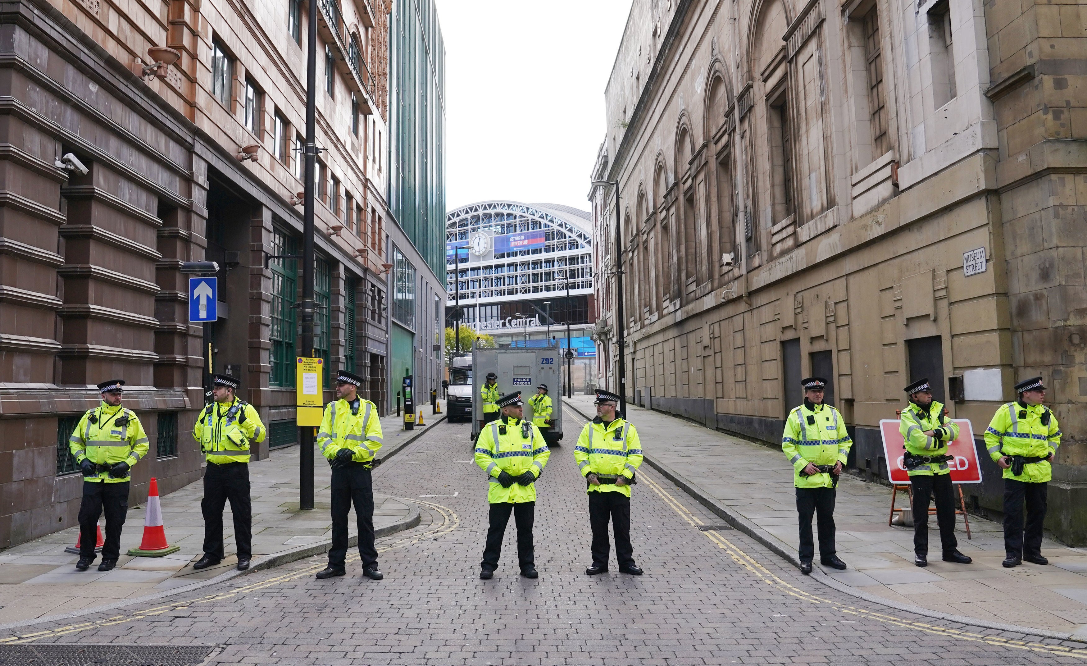 Officers stand outside the Manchester Central Convention Complex during the Conservative Party Conference. Police are reported to have been called to a hotel in the city following the alleged incident