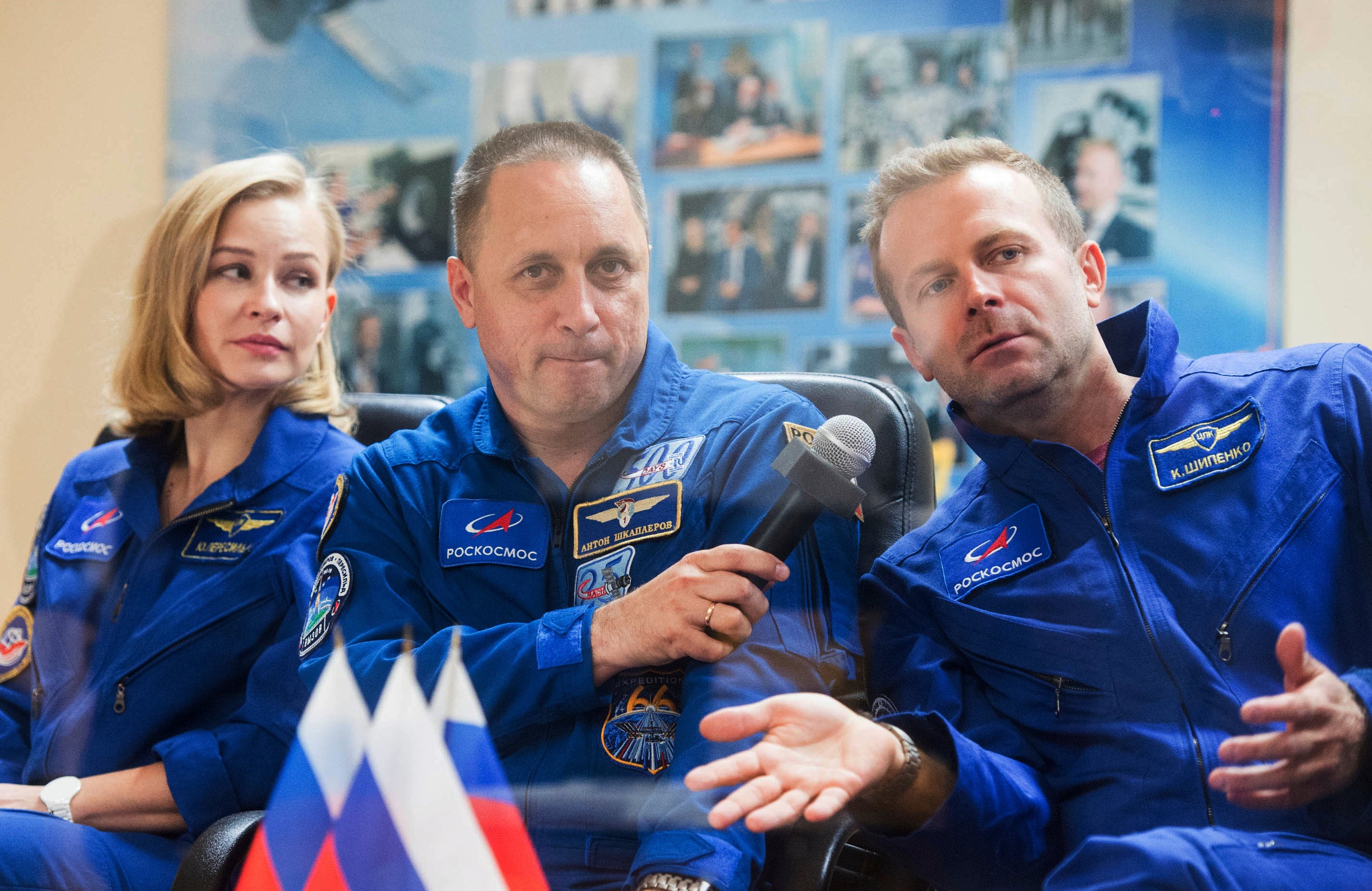 Actor Yulia Peresild, left, director Klim Shipenko, right, and cosmonaut Anton Shkaplerov, members of the prime crew of Soyuz MS-19