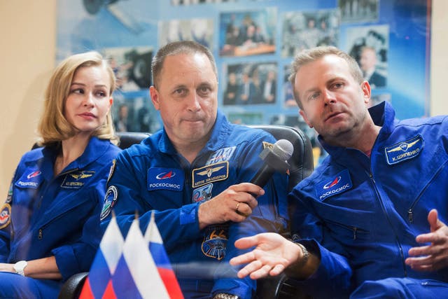 <p>Actor Yulia Peresild, left, director Klim Shipenko, right, and cosmonaut Anton Shkaplerov, members of the prime crew of Soyuz MS-19</p>