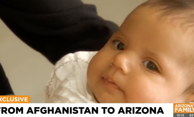 <p>Baby Liya escaped from Kabul after being passed over a barbed wire fence to a US Marine</p>