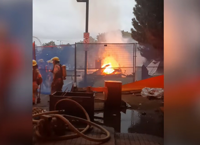 <p>Fire crews douse flames of the wreckage</p>