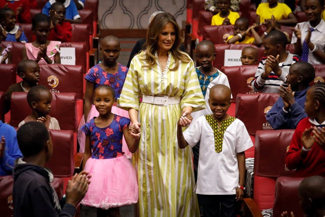 <p>File: Former US first lady Melania Trump smiles as she holds hands with Kenyan children</p>