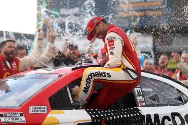 <p>Bubba Wallace, driver of the #23 McDonald’s Toyota, celebrates in the Ruoff Mortgage victory lane after winning the rain-shortened Nascar Cup Series YellaWood 500 at Talladega Superspeedway on 4 October 2021 in Talladega, Alabama</p>