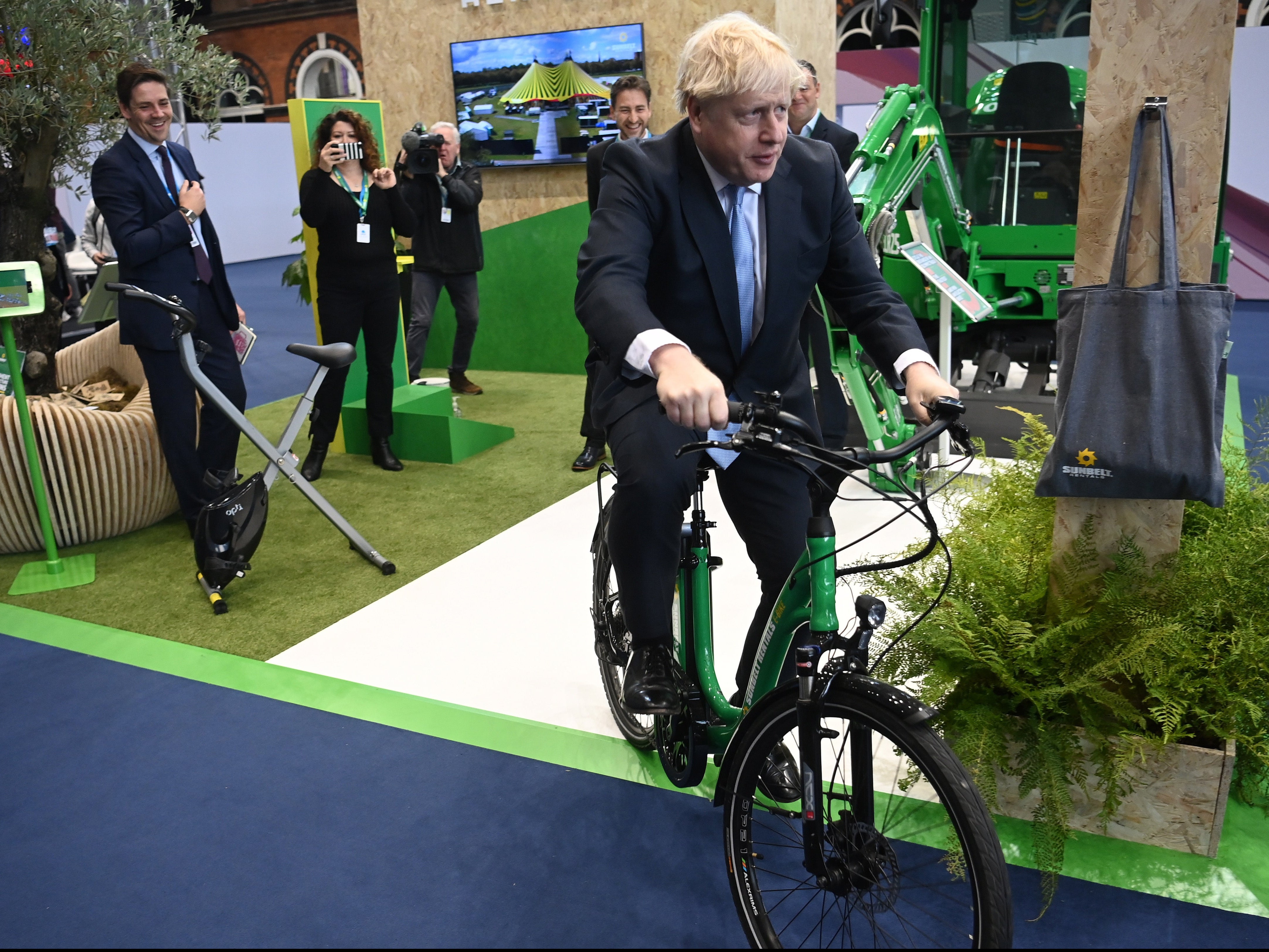 Prime minster Boris Johnson poses with a bike during The Conservative Party’s annual conference in Manchester