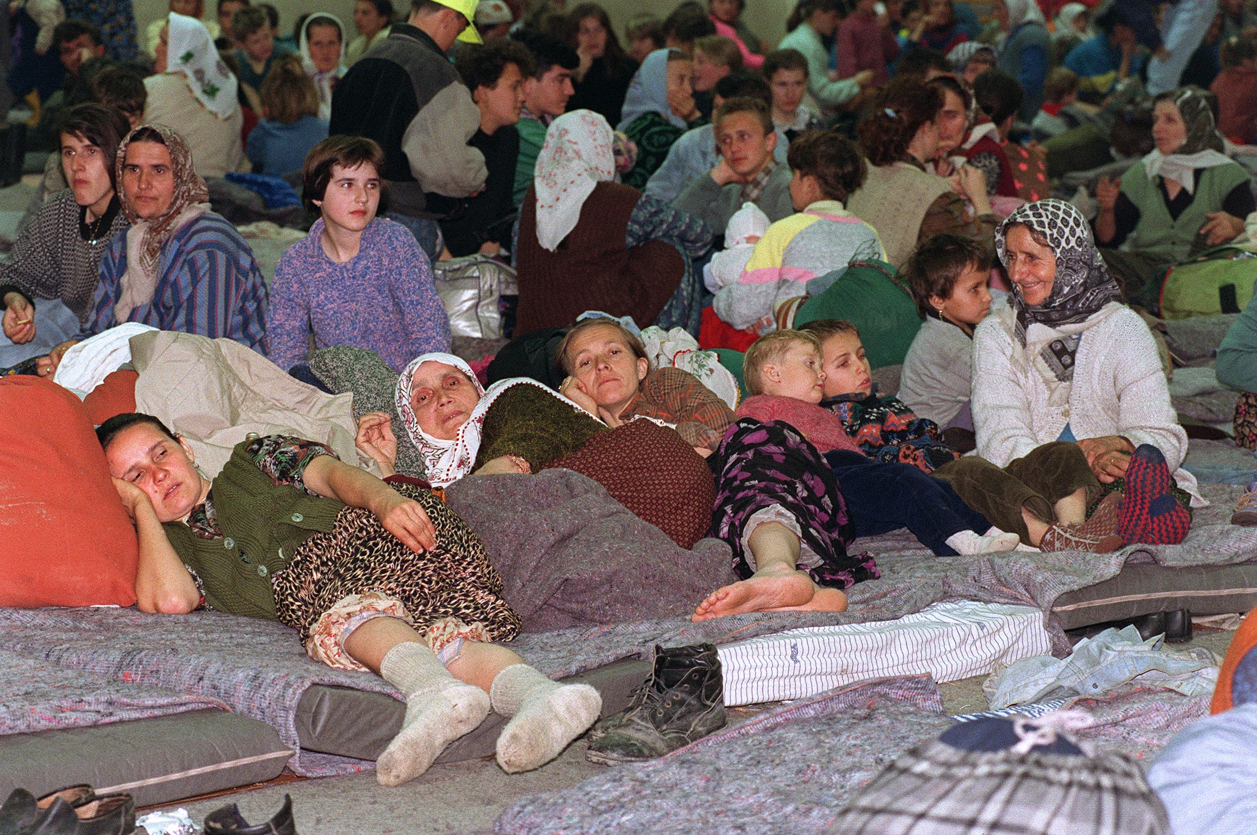 Muslim refugees from Srebrenica crowd a local sport hall in Tuzla in April 1993