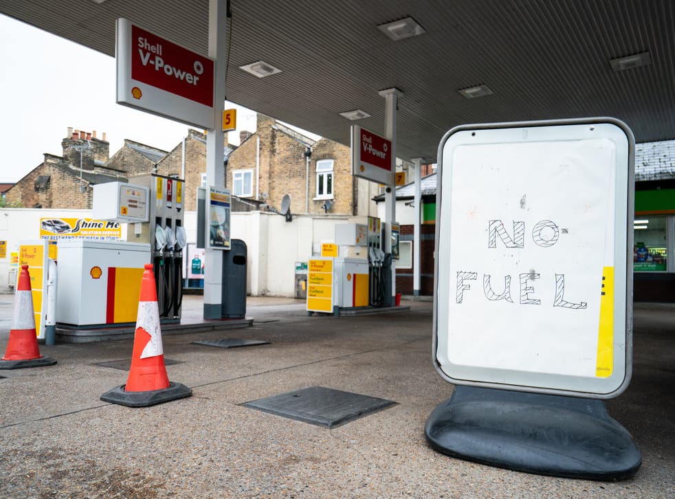 <p>A ‘no fuel’ sign on the forecourt of a petrol station in London (Dominic Lipinski/PA)</p>