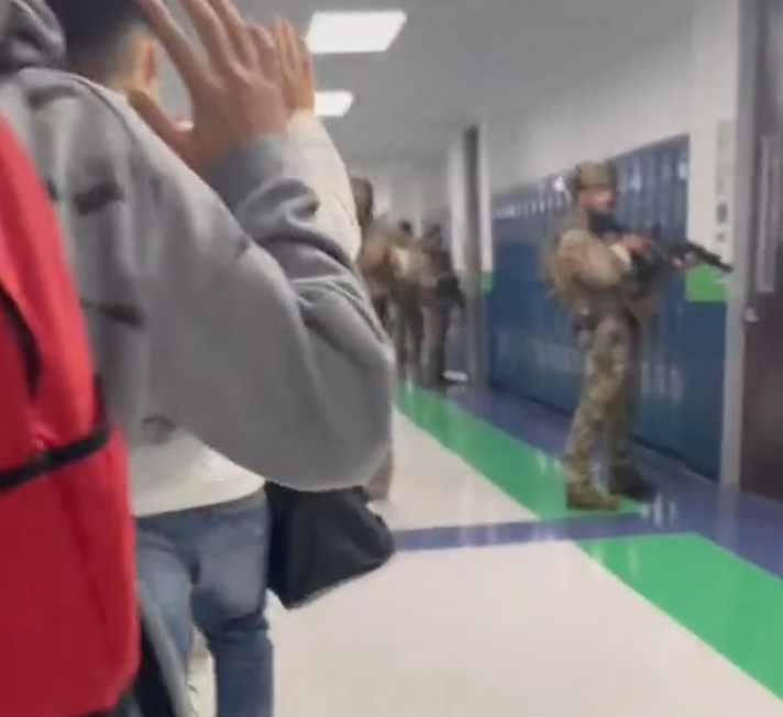 A TikTok shot by a student at a school in Texas shows children evacuating as armed police stand guard