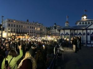 People at a vigil for Sabina Nessa at Eastbourne Pier in East Sussex
