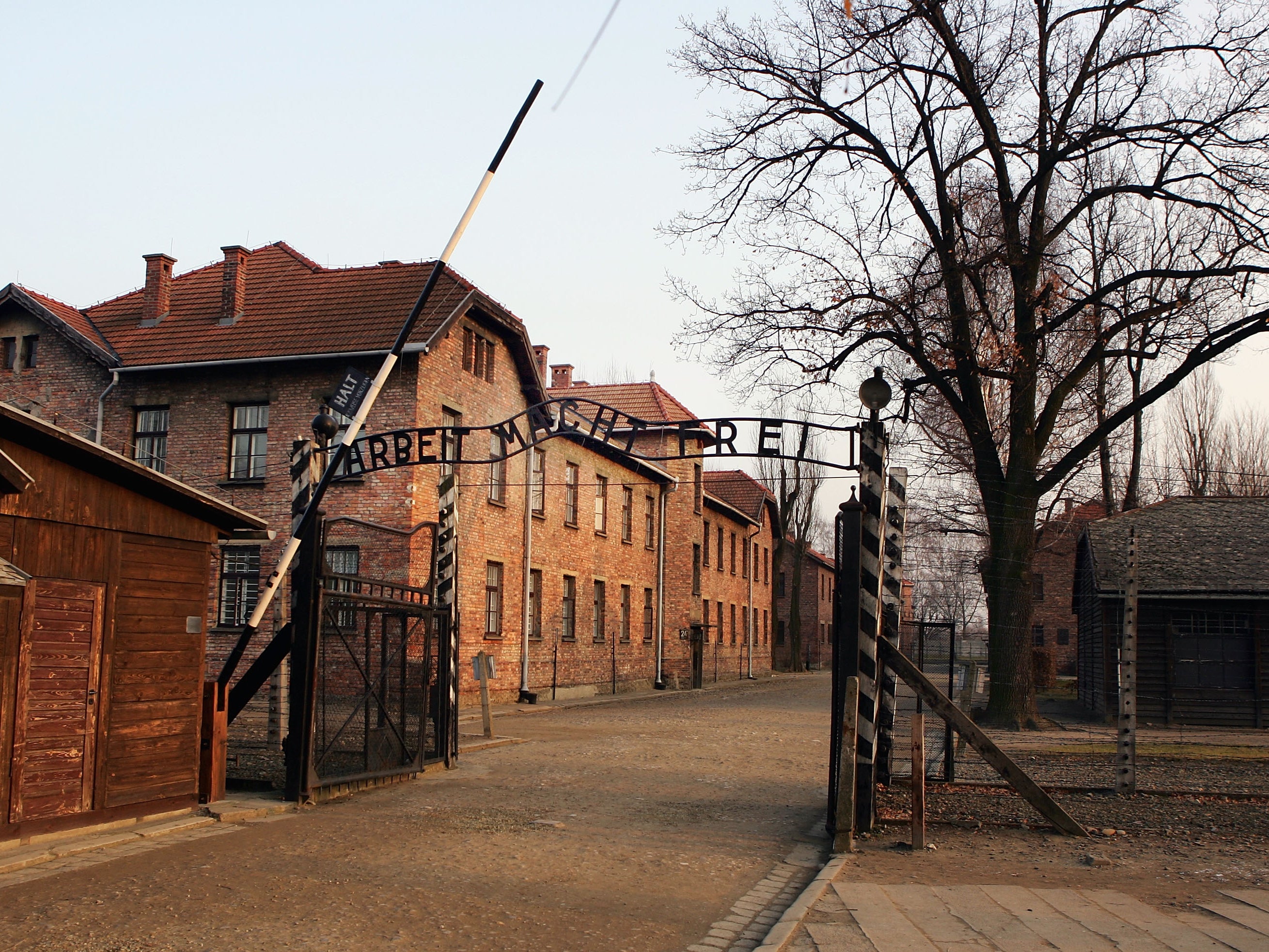 A view showing the entrance gates to Auschwitz with the words ‘Arbeit Macht Frei'