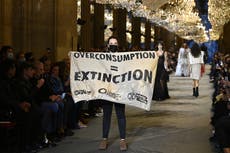 Climate change protestor crashes Louis Vuitton show at Paris Fashion Week
