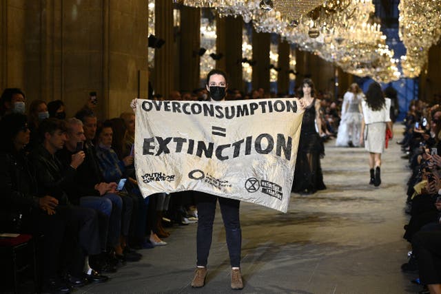 <p>Climate change protestor crashes Louis Vuitton show at Paris Fashion Week</p>