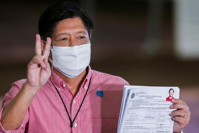 <p>Former senator Ferdinand ‘Bongbong’ Marcos Jr poses after filing his certificate of candidacy</p>