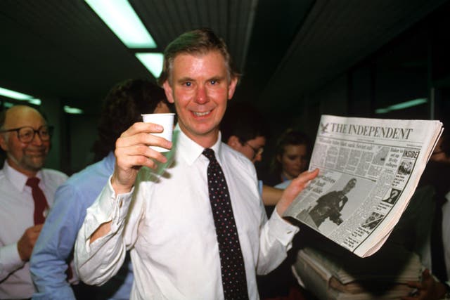 <p>Whittam Smith in the newsroom toasts the first edition on 6 October 1986 </p>