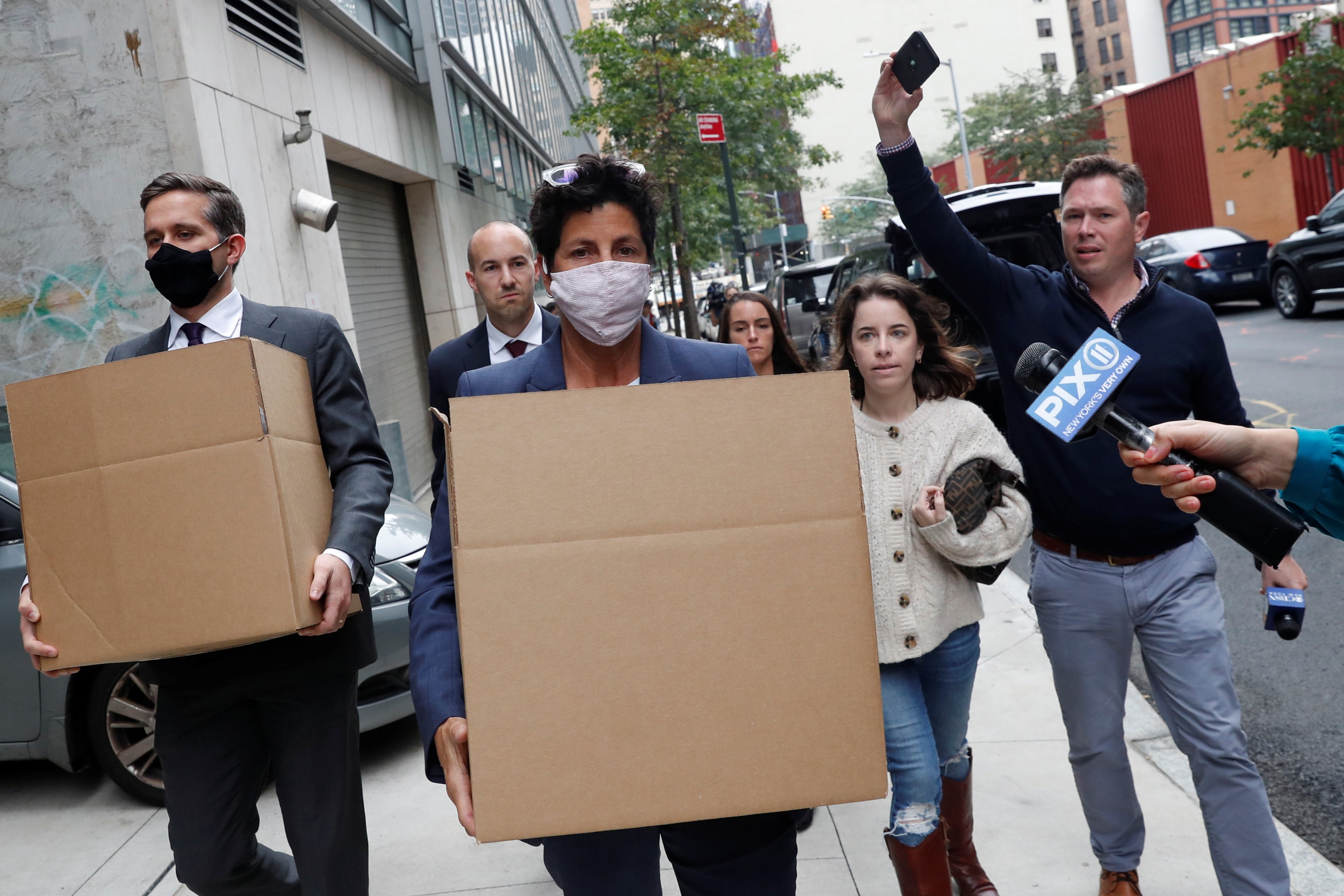 FBI agents carry boxes from the SBA headquarters, where local reports confirmed the agency was conducting an investigation