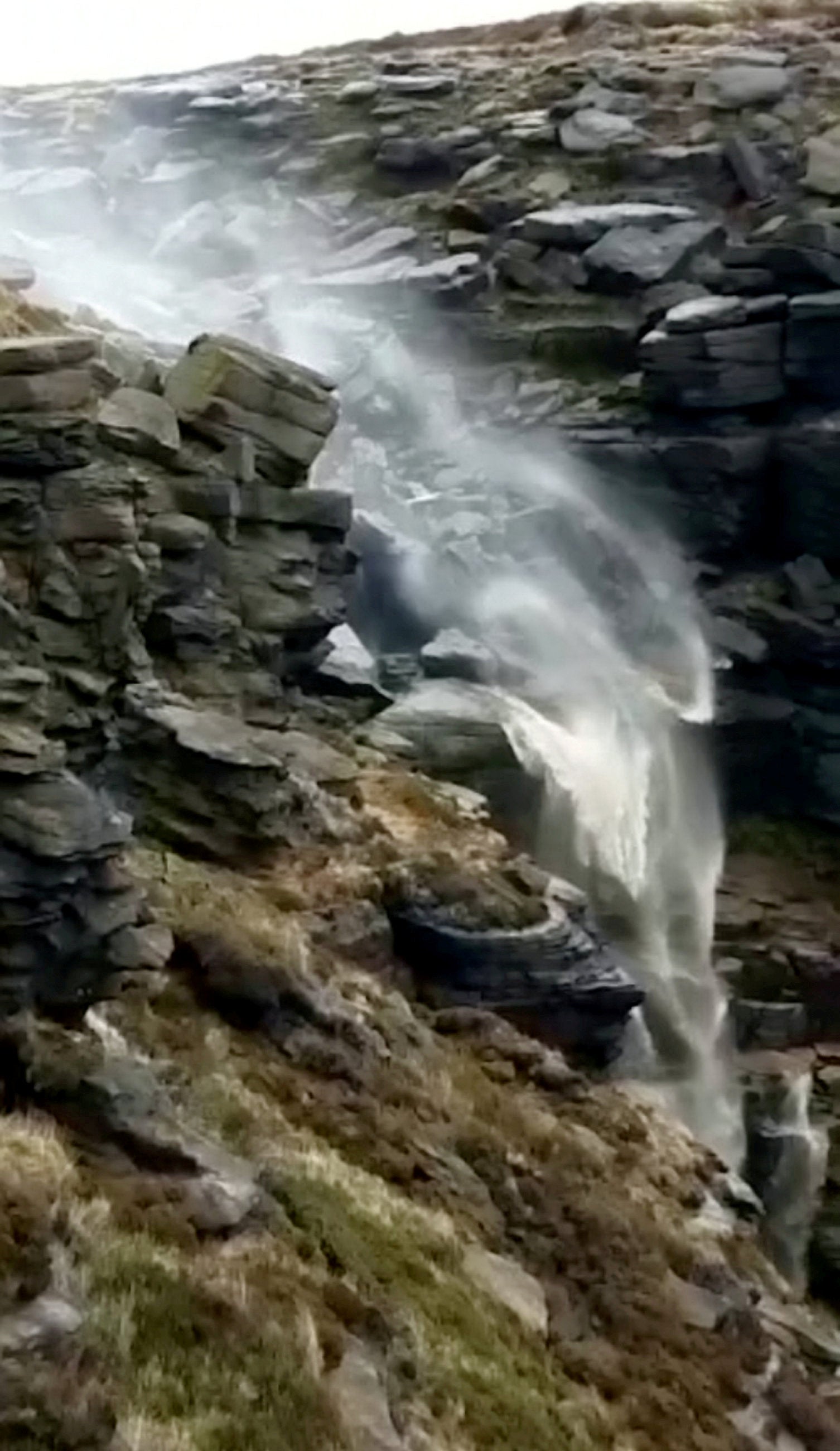 A walker described seeing a waterfall flowing backwards as high winds hit the Peak District as, "looking like the hill was on fire from below"
