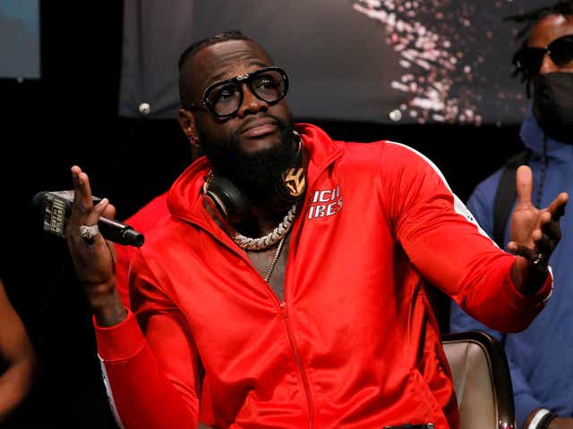 <p>Deontay Wilder gestures during a news conference at MGM Grand Garden Arena</p>