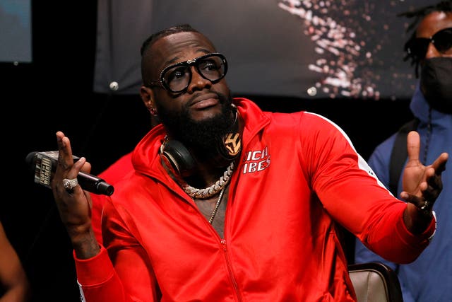 <p>Deontay Wilder gestures during a news conference at MGM Grand Garden Arena</p>