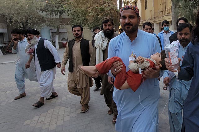 <p>A victim of the earthquake is carried to a hospital in Quetta, Balochistan province, Pakistan</p>