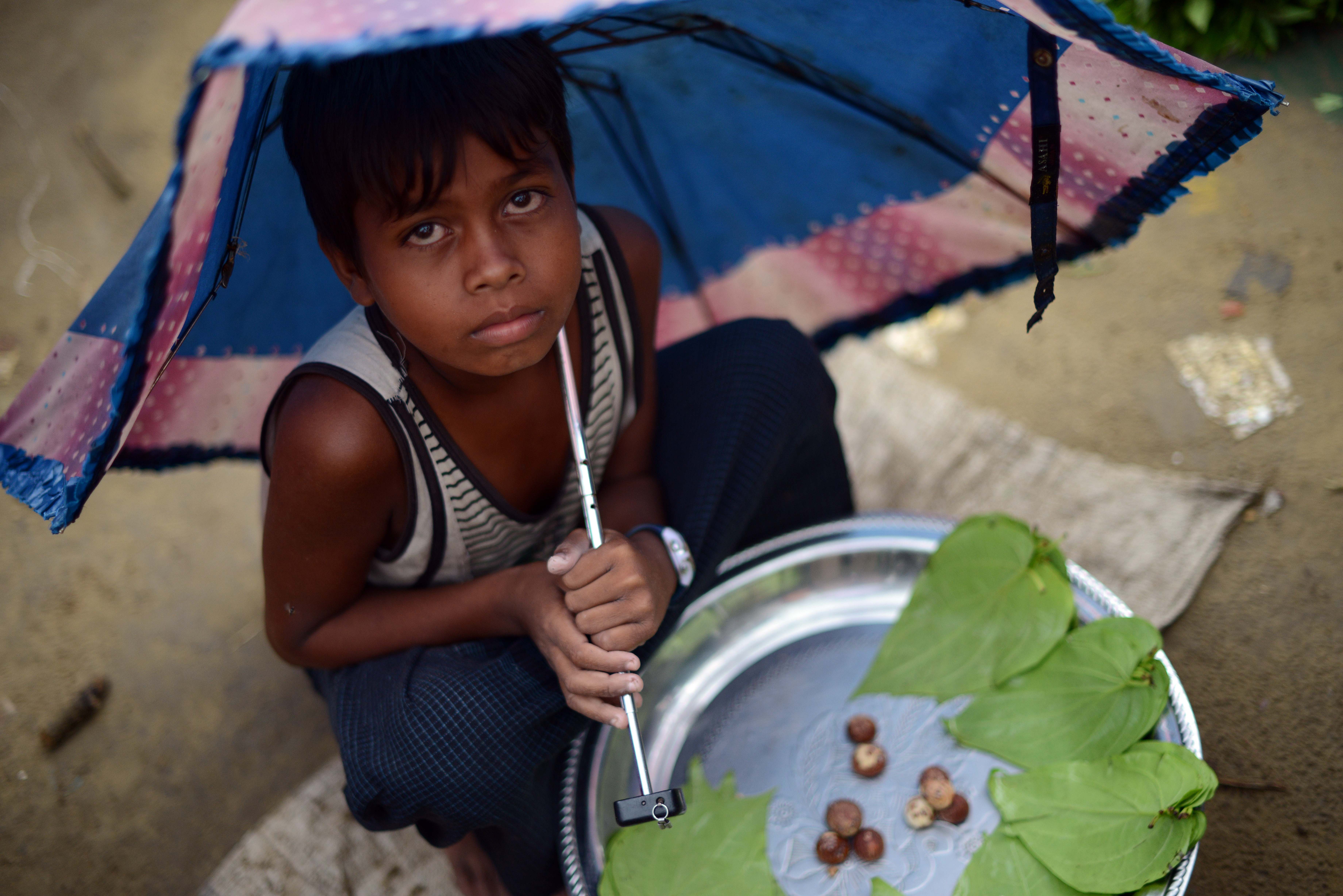 A boy selling betel leaves at a market at the Say Thamagyi Internally Displaced Persons (IDP) camp located on the outskirts of Sittwe, capital of Myanmar’s western Rakhine state