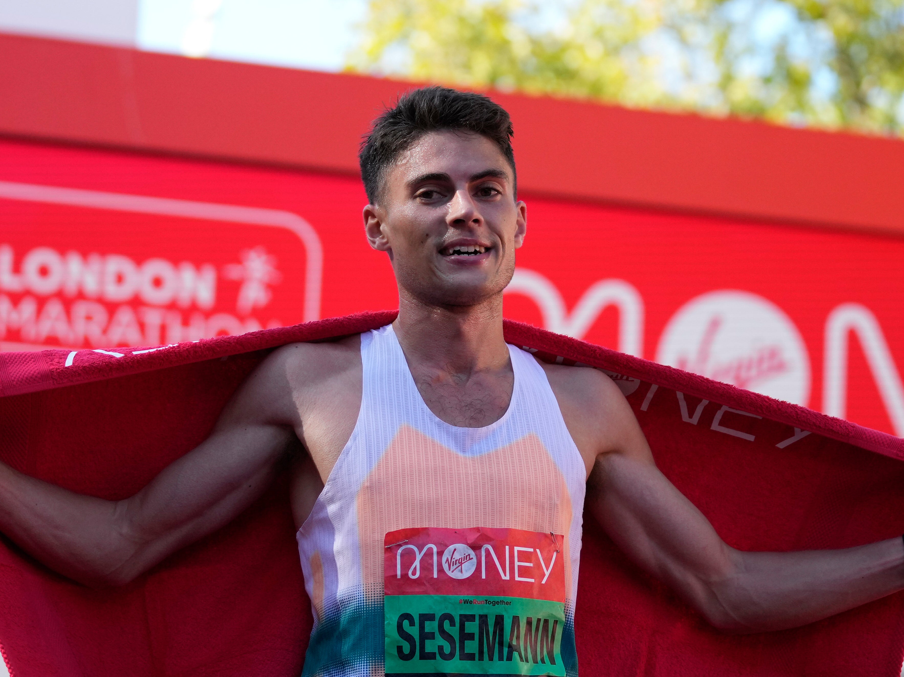 Sesemann celebrates after being the first British runner to cross the finish in the men’s elite race