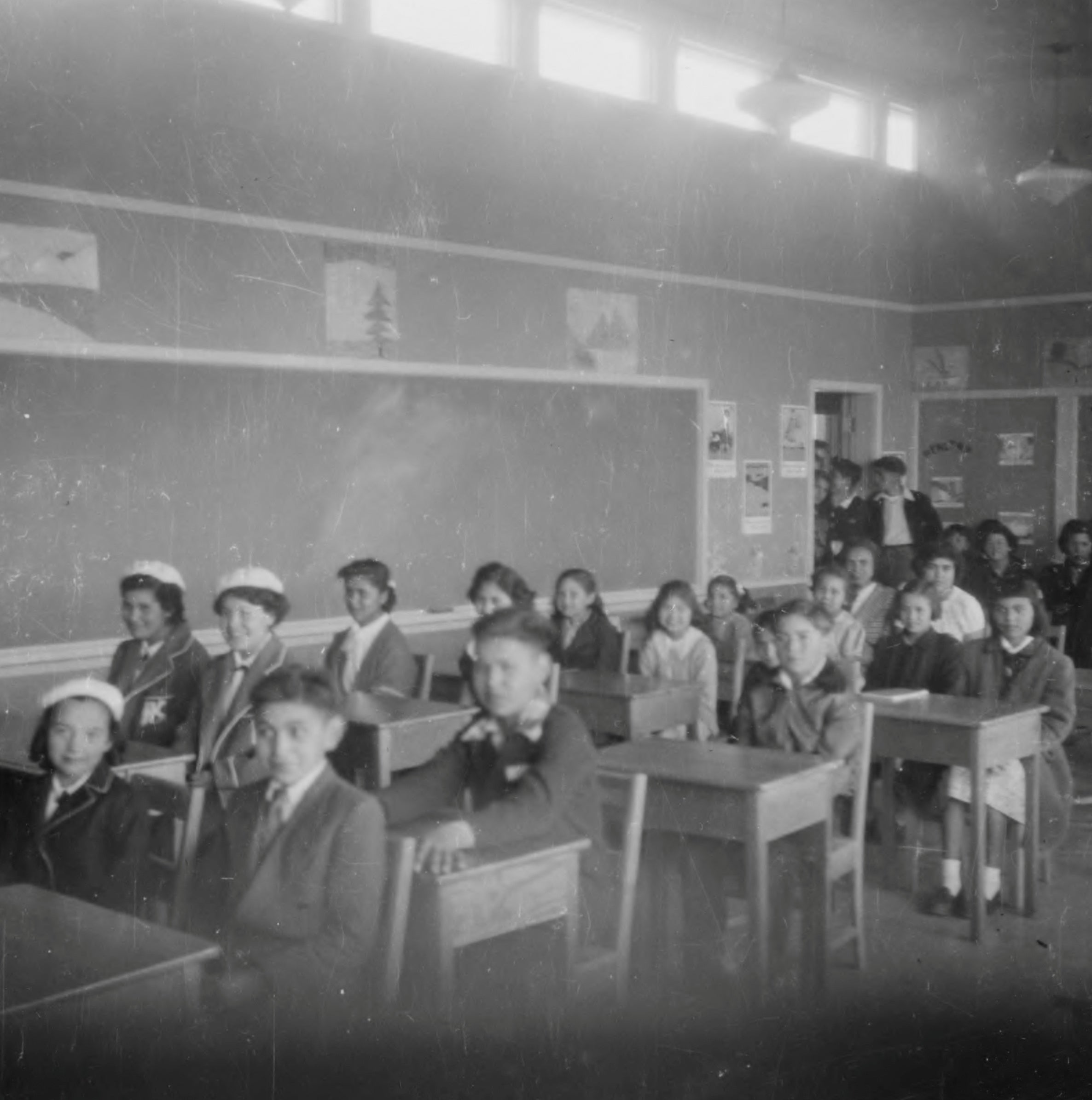 Students sit in a classroom at the Kuper Island Indian Residential School, which according to the National Centre for Truth and Reconciliation operated from 1890-1975, near Chemainus, British Columbia,