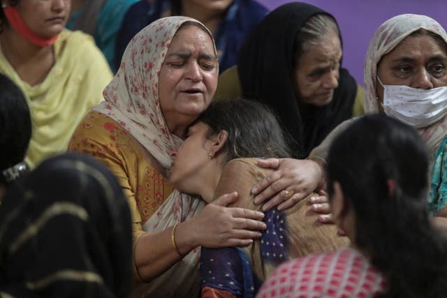 <p>Relatives of Deepak Chand, one of two schoolteachers shot dead by assailants in India’s Kashmir on Thursday mourn at their residence</p>