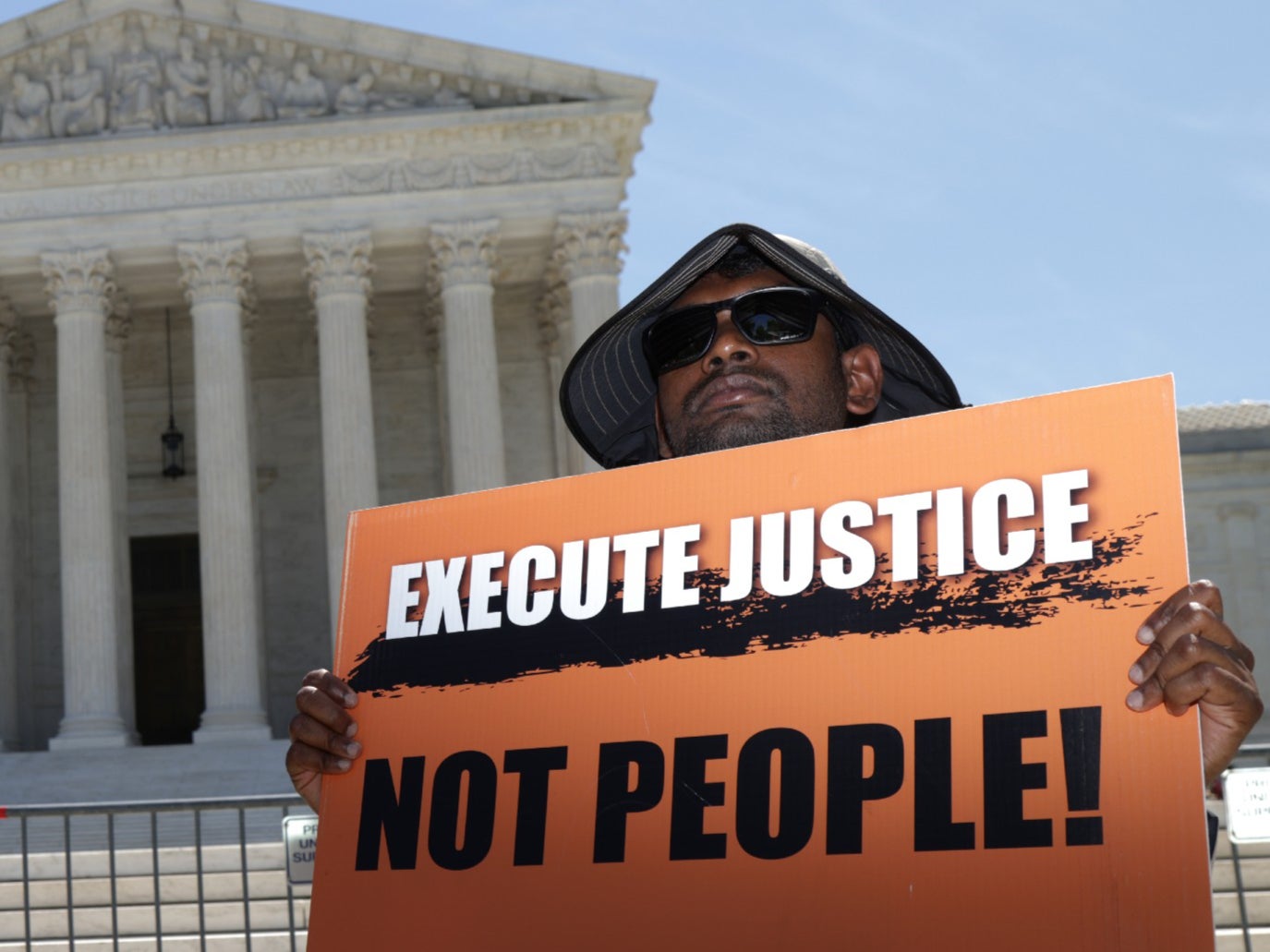 <p>A vigil against the death penalty in front of the Supreme Court earlier this year</p>