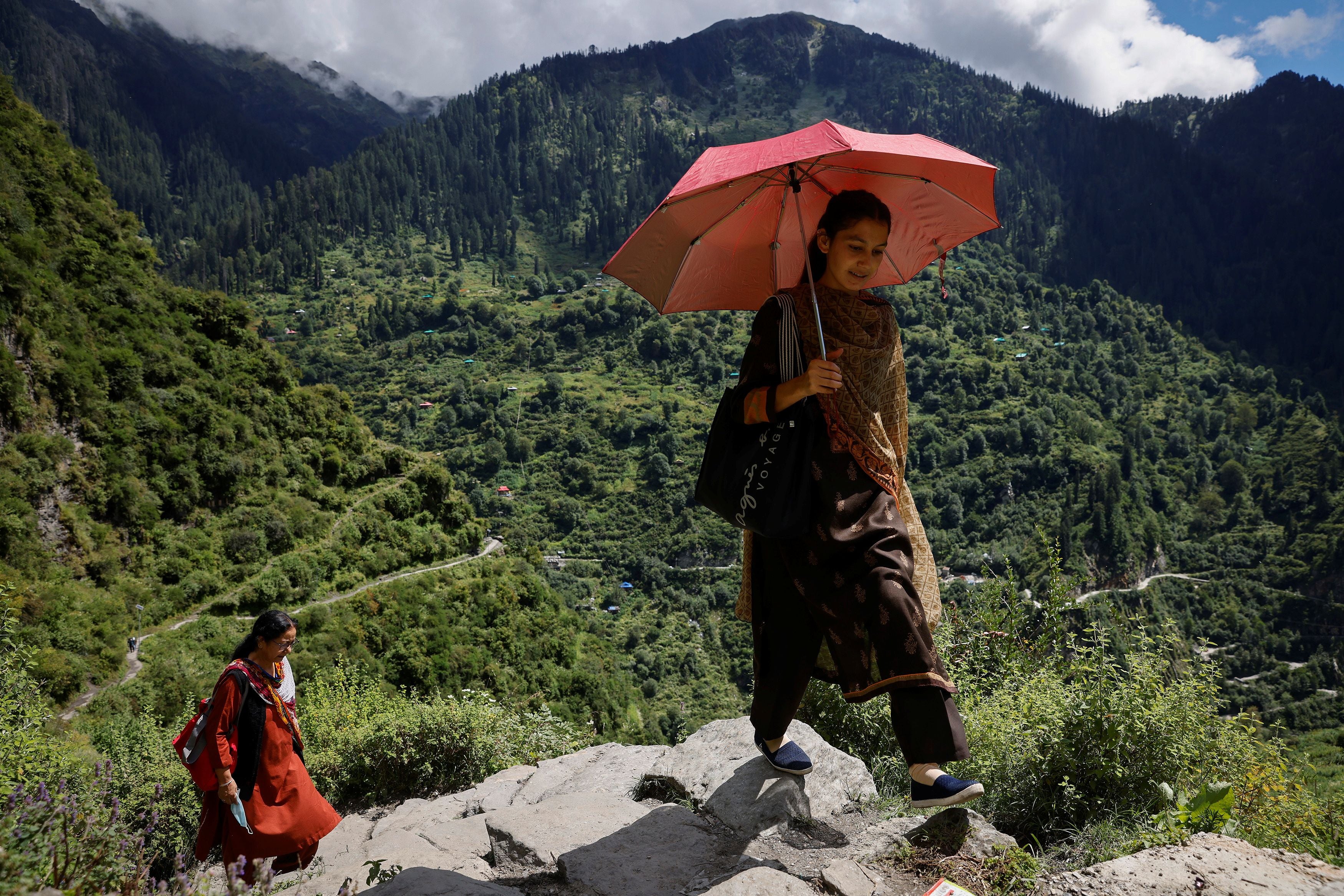 Kamla and Kanta Devi (right) trek through the mountains to vaccinate villagers