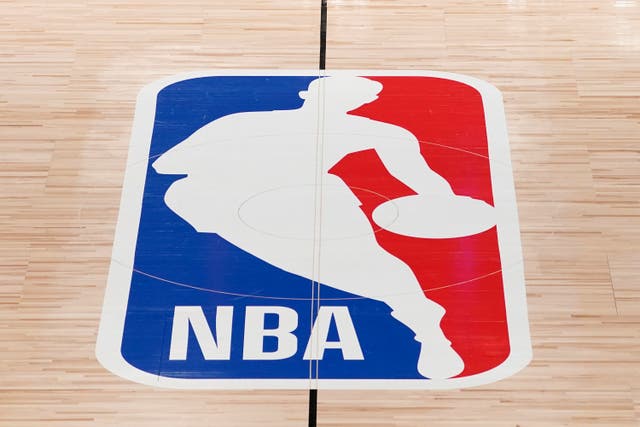 <p>The NBA logo at center court </p>