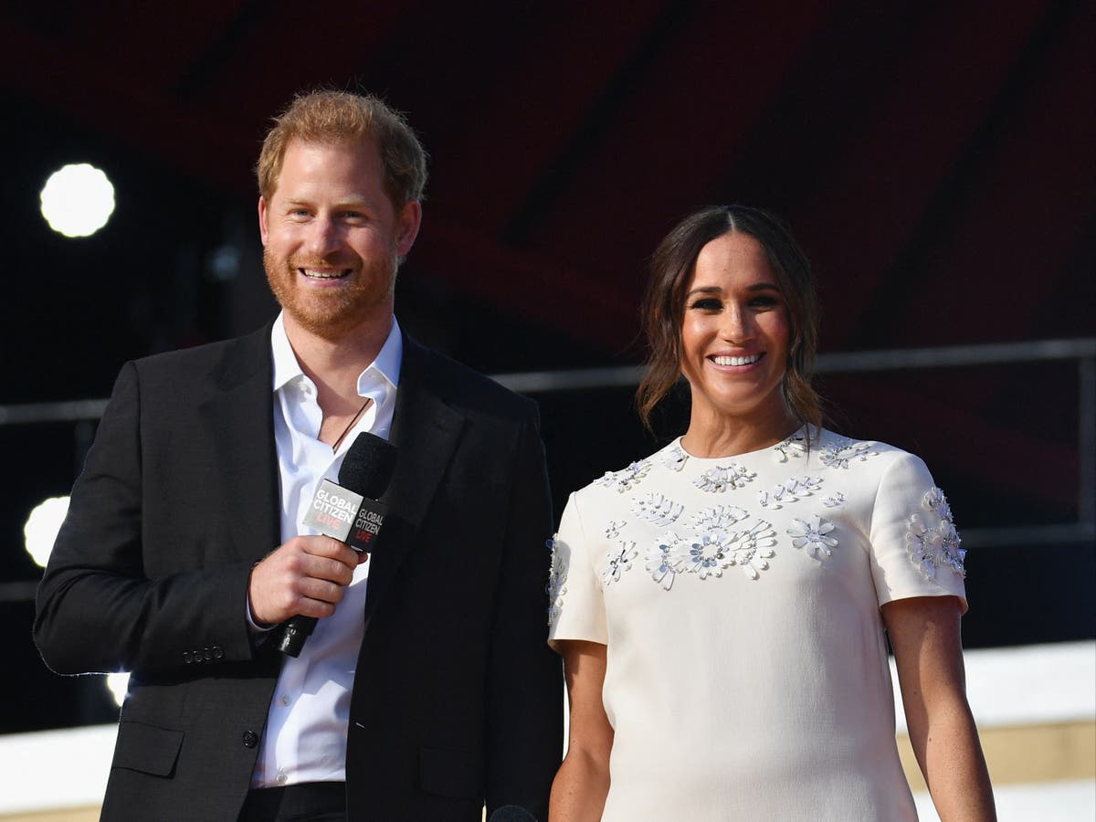 Meghan Markle Steps Out With Prince Harry Wearing This Season's It Bag