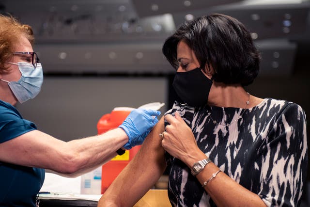 <p>In this photo provided by the National Foundation for Infectious Diseases, CDC Director Rochelle Walensky receives her flu shot on Tuesday, Oct. 5, 2021 in Atlanta.</p>