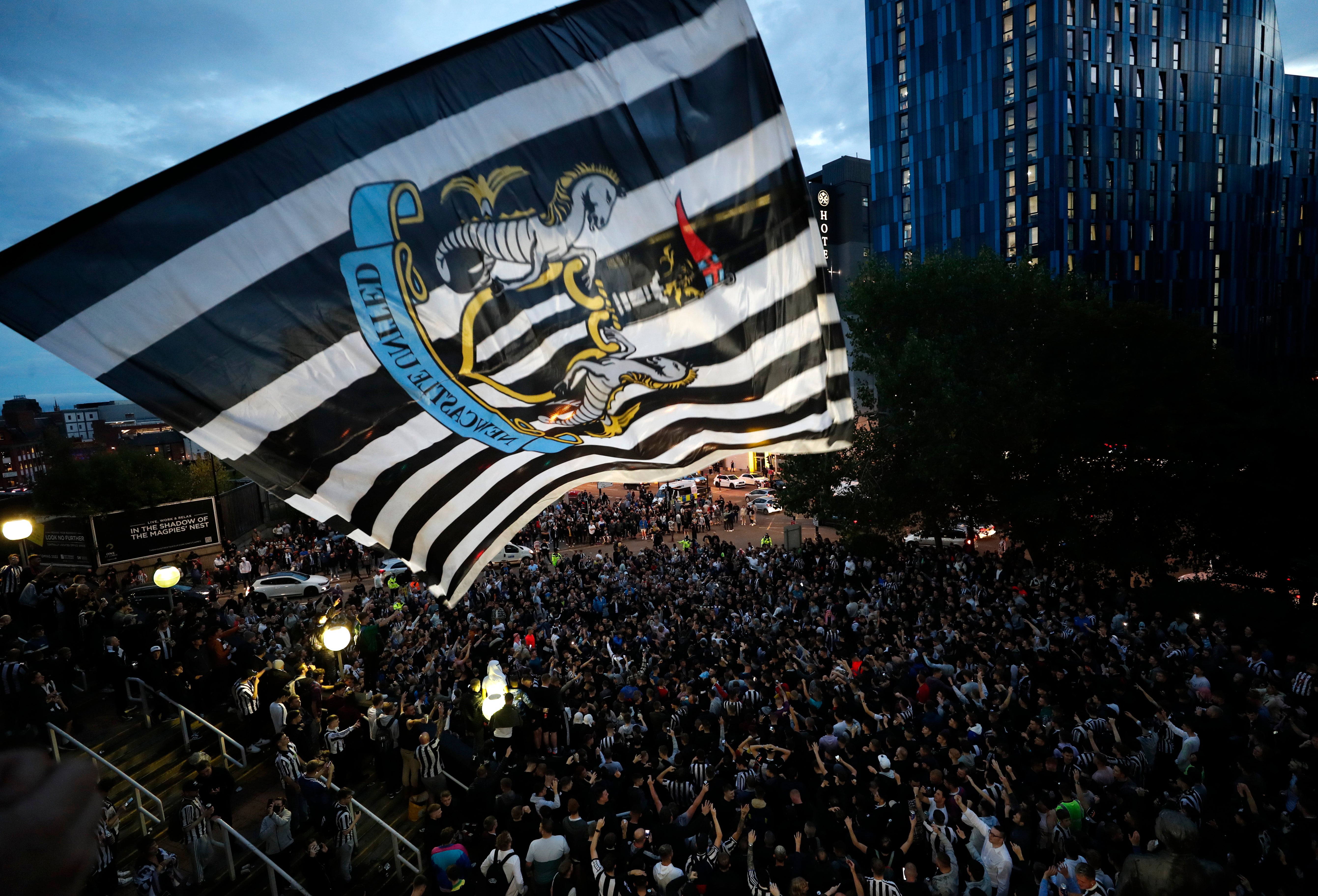 Newcastle fans celebrate the takeover at St James’ Park