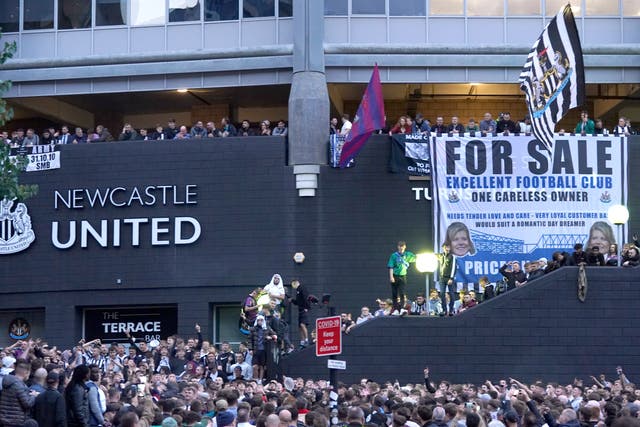 Newcastle fans celebrate the completion of the takeover (Owen Humphreys/PA).