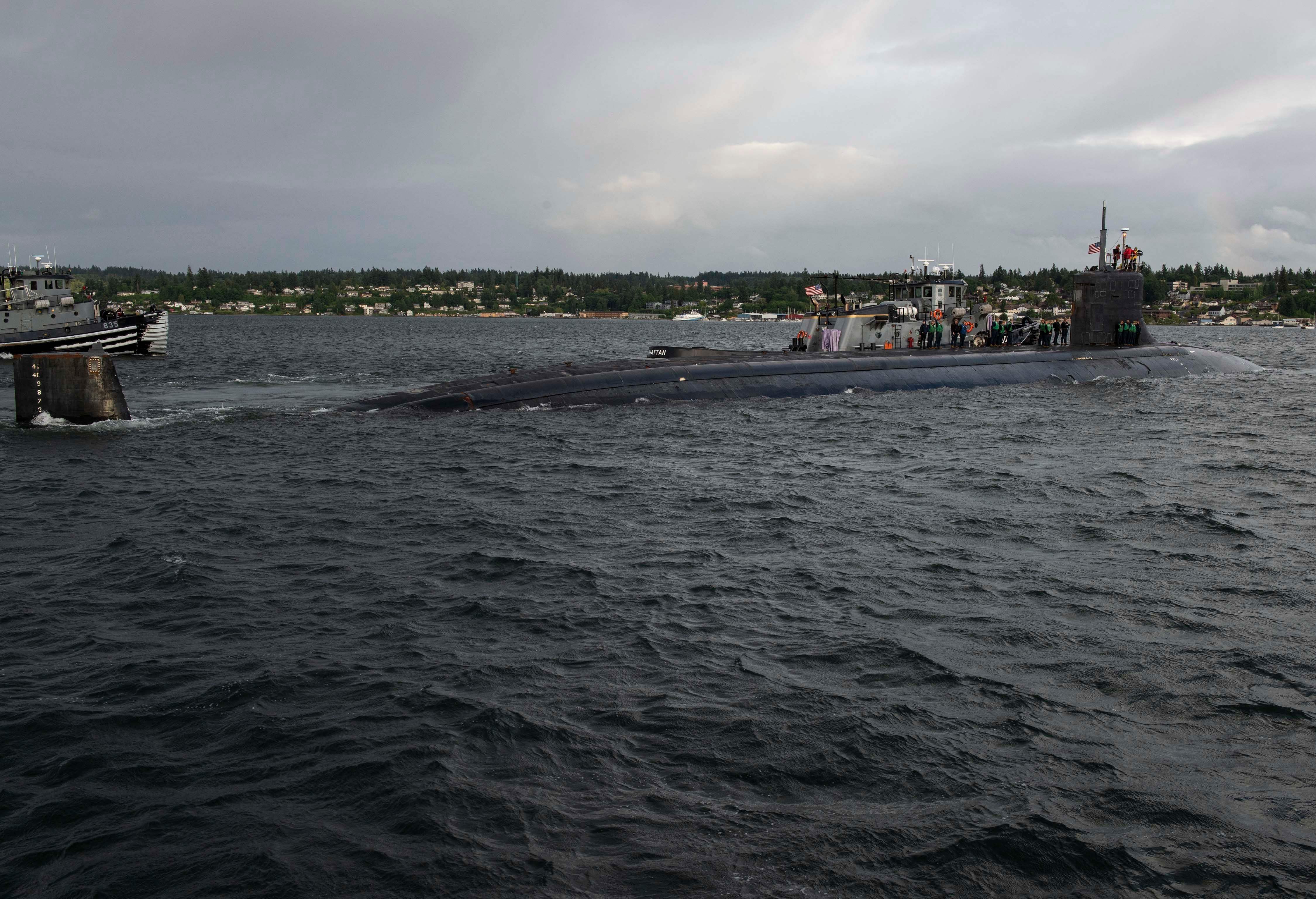 The USS Connecticut submarine, pictured departing Washington in May, was involved in a underwater collision in the South China sea.