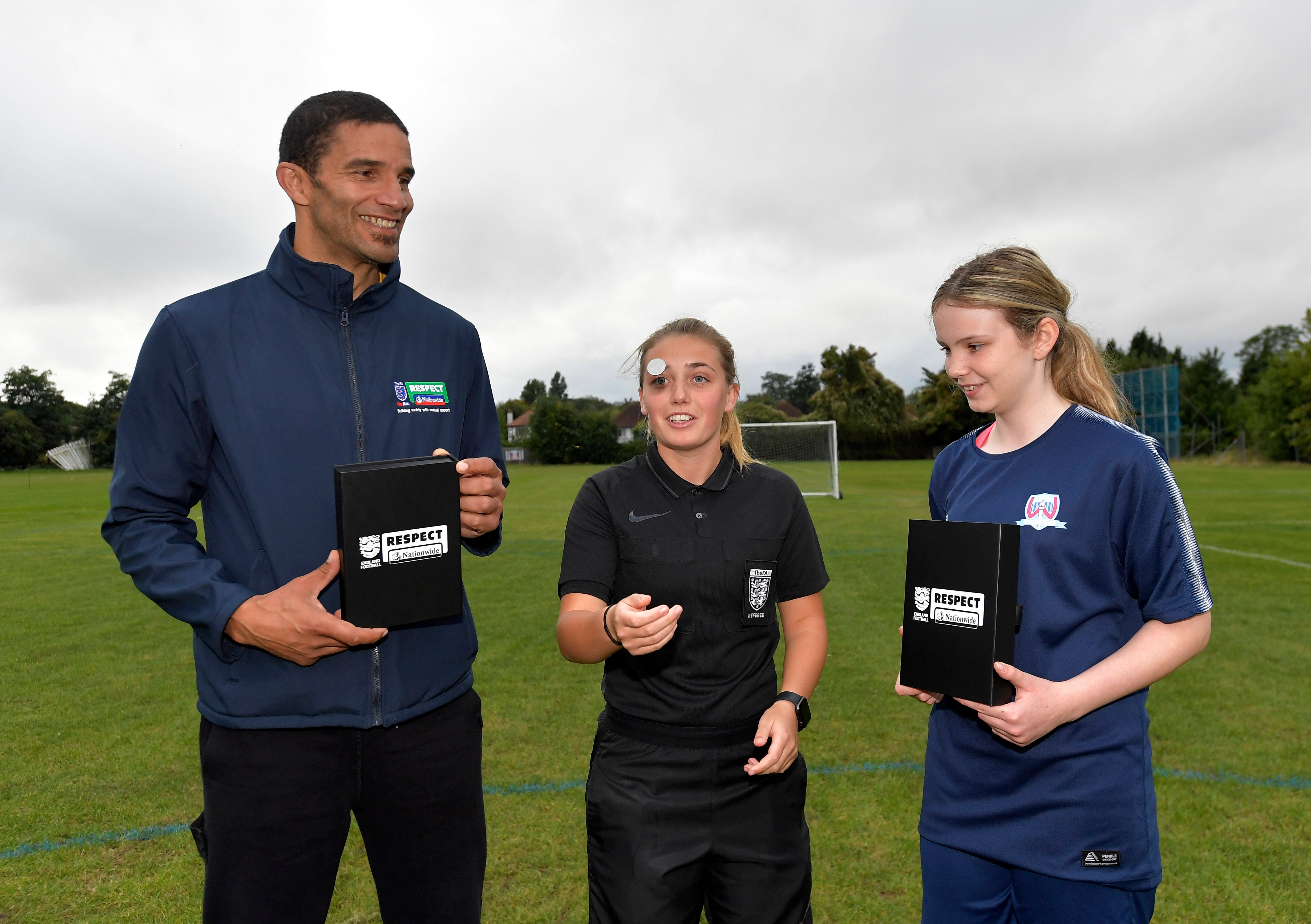 David James, referee Ella Broad and competition winner Chloe at the first Coin for Respect match (Nationwide)