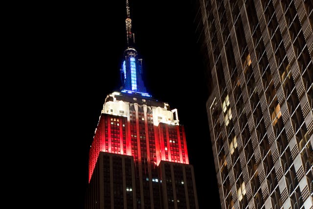 <p>The Empire State Building lit up in red, white and blue</p>