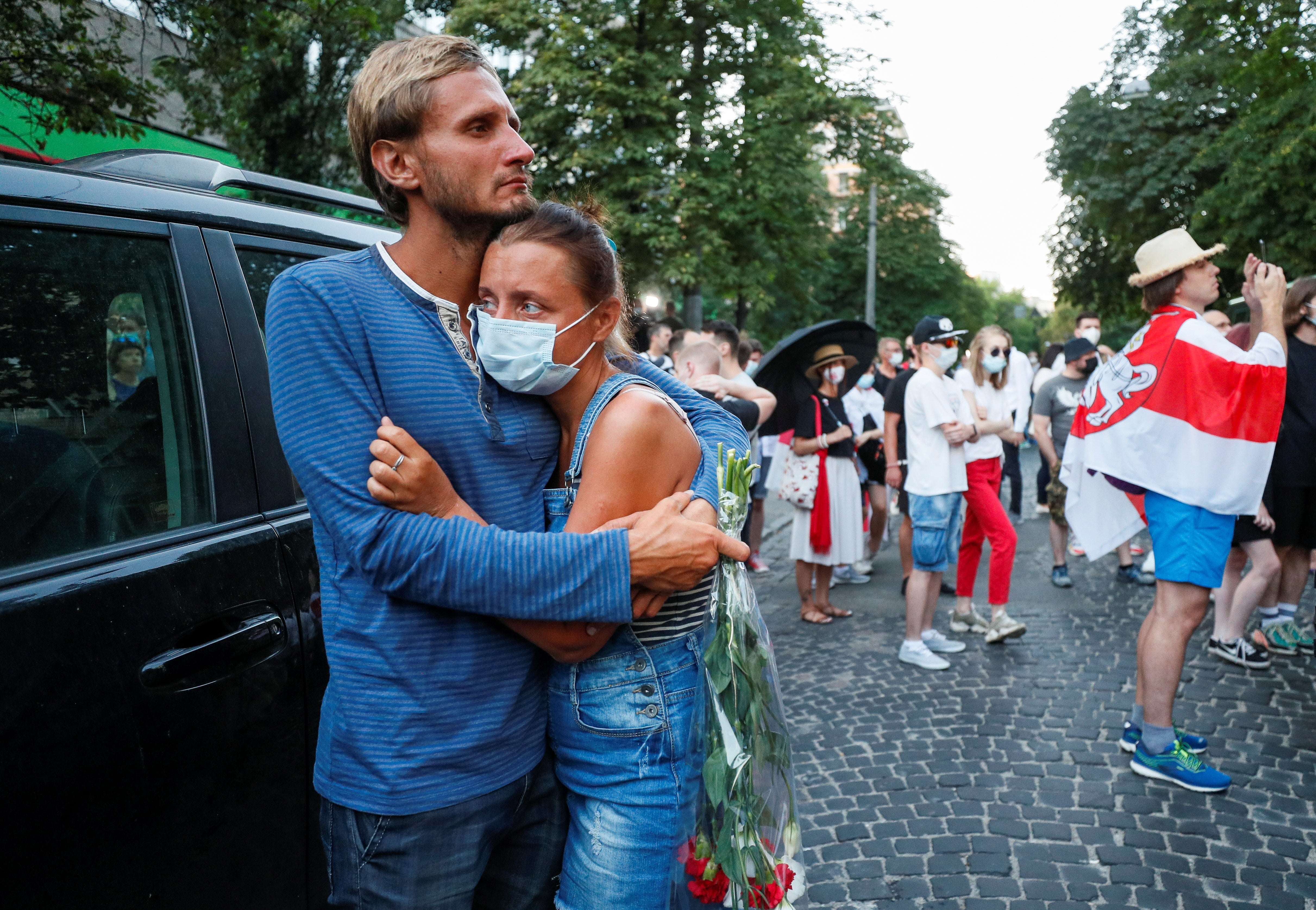 People attend a rally next to the Belarusian Embassy to Ukraine to commemorate Vitaly Shishov, a Belarusian activist living in exile who was found hanged in a park near his home in August