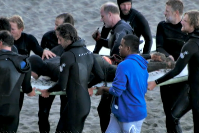 <p>Eric Steinley, 38, being pulled in from a California beach after great white shark attack</p>