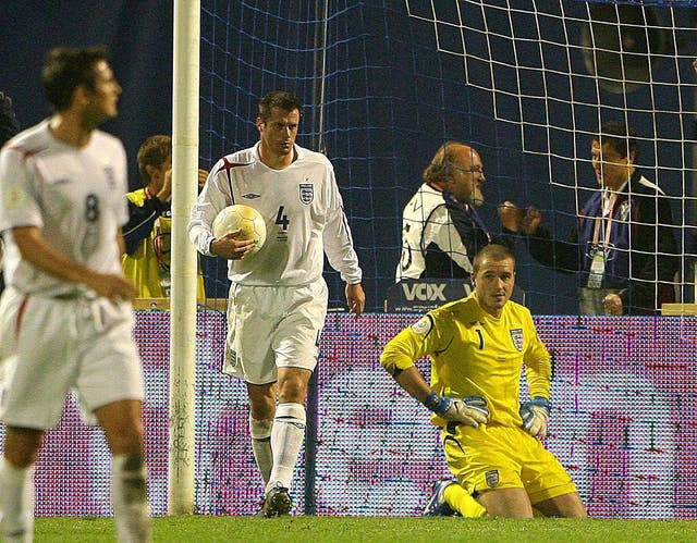 Paul Robinson, right, looks dejected after his goalkeeping clanger (Owen Humphreys/PA)