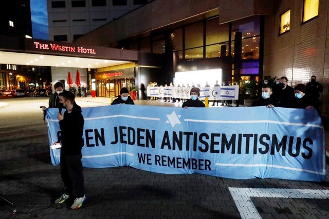 <p>People gather in front of the "Westin Hotel" in Leipzig, Germany, Tuesday, Oct. 5, 2021 to show solidarity with the musician Gil Ofarim</p>