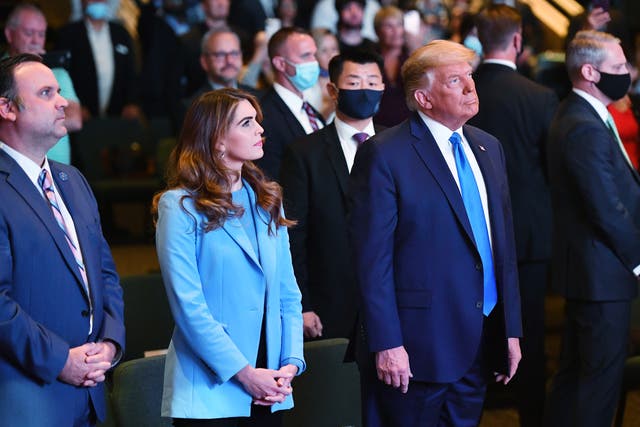 <p>Hope Hicks, senior adviser to the president, and White House Deputy Chief of Staff for Communications Dan Scavino(L) attend services with US President Donald Trump at the International Church of Las Vegas in Las Vegas, Nevada, on October 18, 2020. </p>