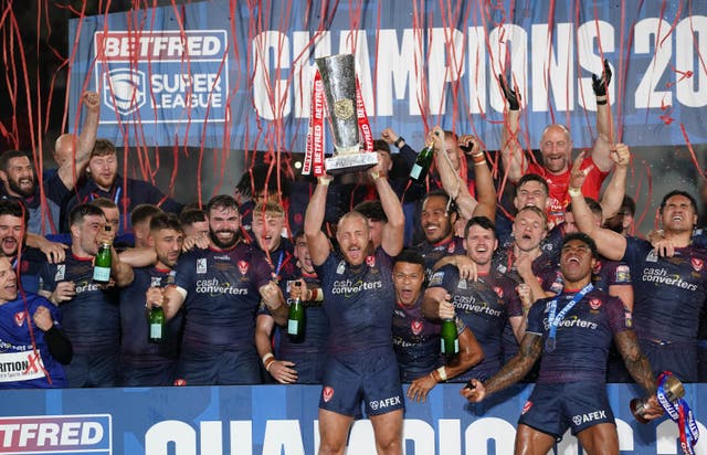 <p>St Helens captain James Roby lifts the trophy after his side’s eighth Grand Final triumph</p>