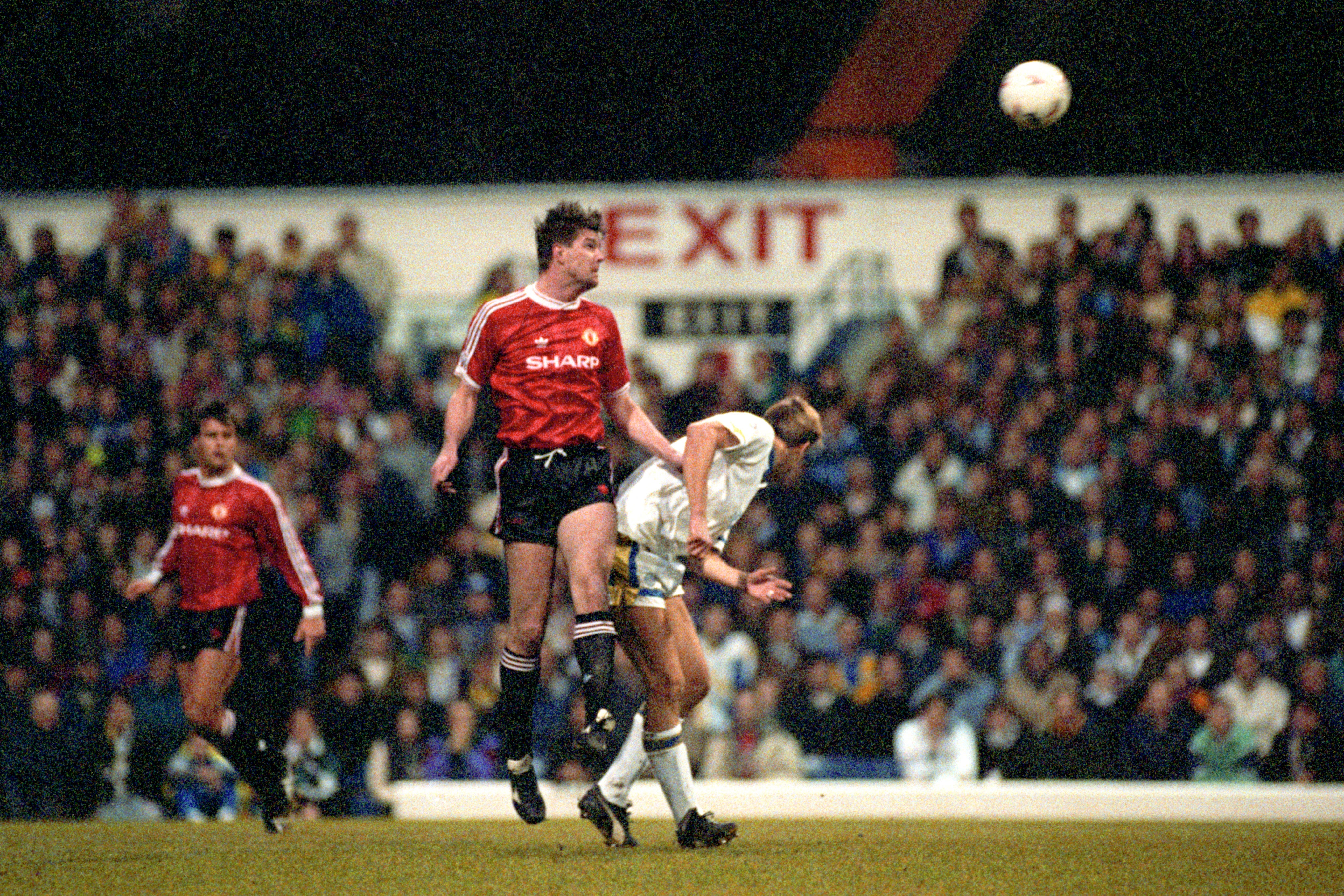 Manchester United centre-back Gary Pallister heads the ball against Leeds (John Giles/PA)